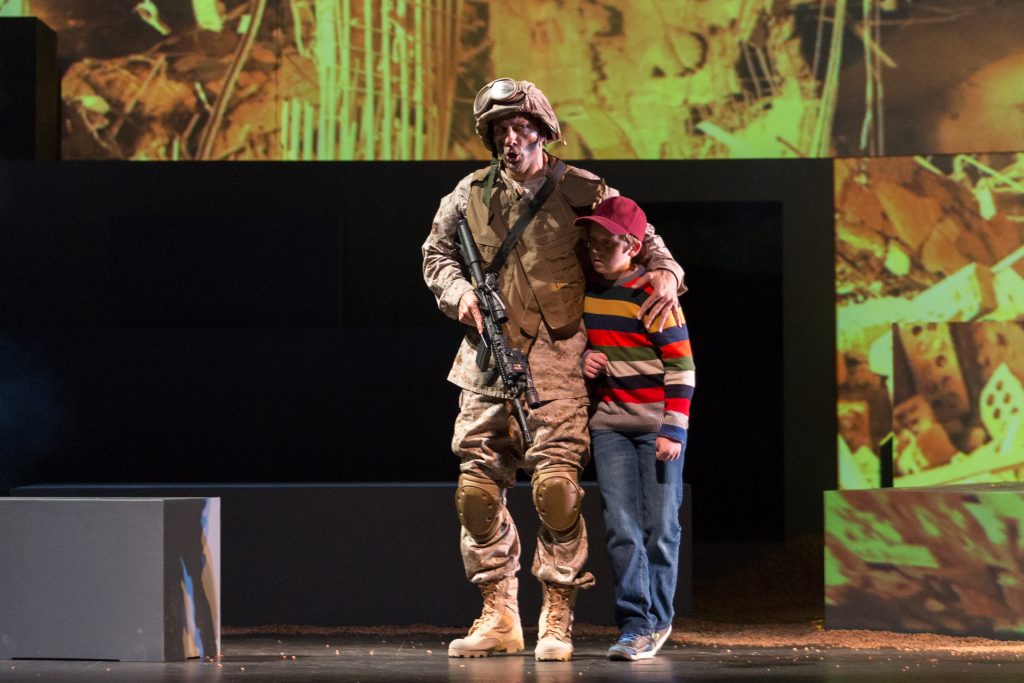 Baritone David Adam Moore is the Soldier and actor Ryan Singer is the Child in San Diego Opera's SOLDIER SONGS. November, 2016. Photo copyright Karli Cadel. 